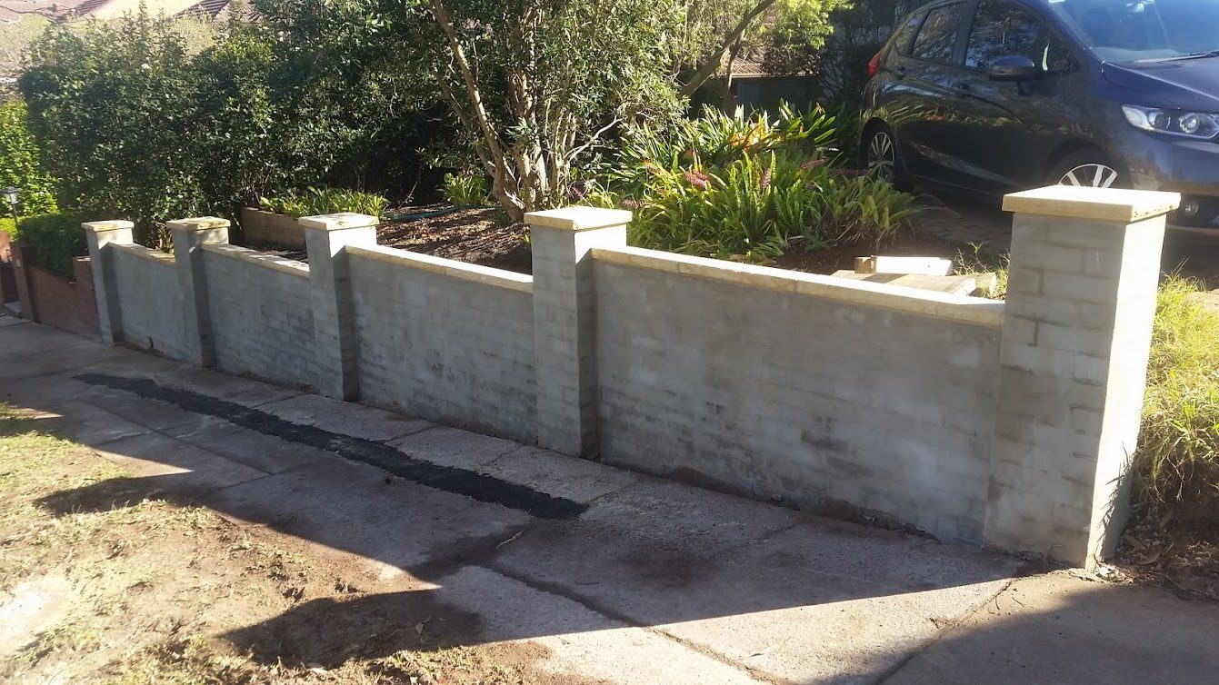 Brick fence with sandstone caps - Artarmon